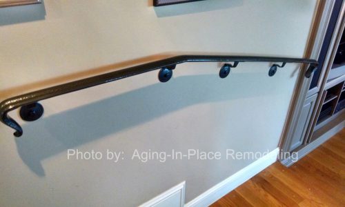 Custom fabricated handrail creates a safe transition between rooms