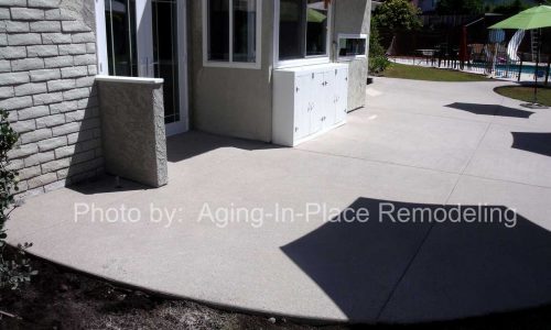 Custom concrete sloping entry to back door