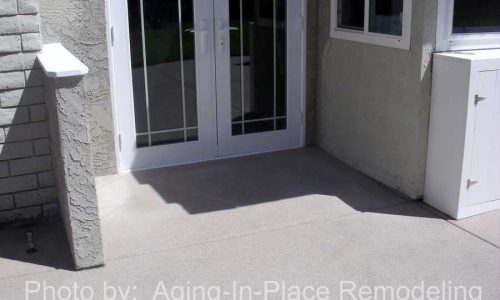 Custom concrete sloping entry to back door