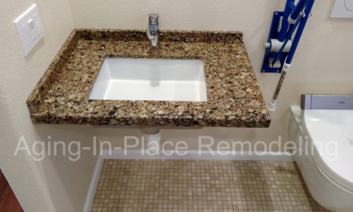 Custom countertop wheelchair accessible roll under sink for fully accessible bathroom.