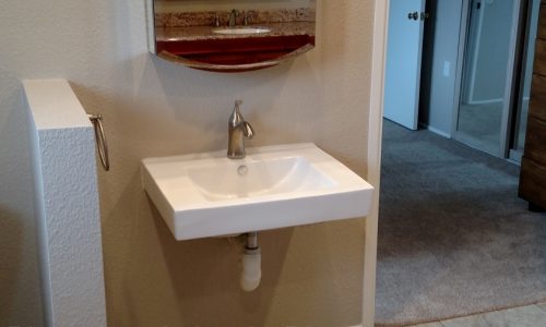 Roll Under wheelchair accessible sink in newly remodeled accessible bathroom