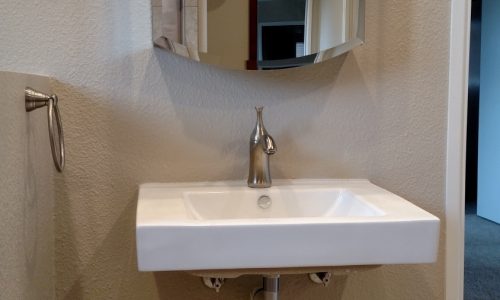 Roll Under wheelchair accessible sink in newly remodeled accessible bathroom
