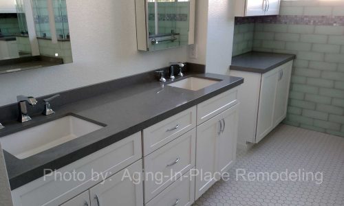 Bathroom remodel with low threshold shower, built in shower bench, grab bars and custom tile