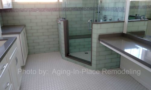 Bathroom remodel with low threshold shower, built in shower bench, grab bars and custom tile