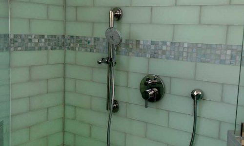 Bathroom remodel with low threshold shower, built in shower bench, grab bars and custom tile