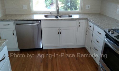 Kitchen Remodel with classic white cabinets and back splash, quartz counter tops, stainless steel appliances for a sleek modern look