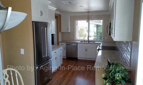 Kitchen Remodel with classic white cabinets and back splash, quartz counter tops, stainless steel appliances for a sleek modern look