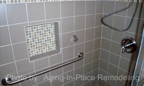 Bathroom remodel with low threshold shower, built in shower bench, grab bars and custom tile