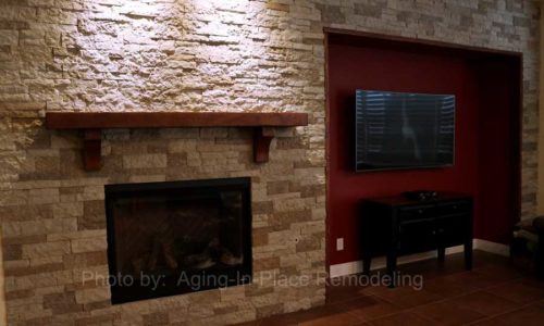 Custom stone wall with updated fireplace and custom mantel