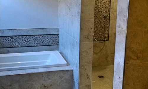 Wheelchair accessible bathroom remodel with roll-in shower, custom tile shower, grab bars