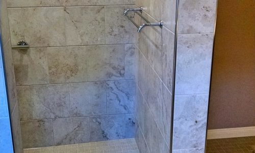 Wheelchair accessible bathroom remodel with roll-in shower, custom tile shower, grab bars