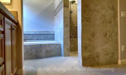 Wheelchair accessible bathroom remodel with roll-in shower, custom tile shower, grab bars