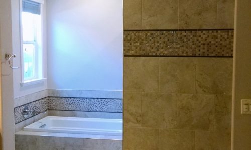 Wheelchair accessible bathroom remodel with roll-in shower, custom tile shower, grab bars