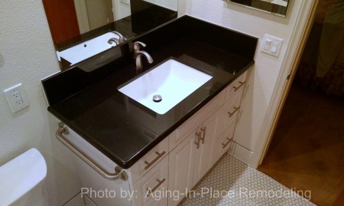 Low Threshold tile shower with fold up shower seat and grab bars, accessible renovation, aging in place bathroom