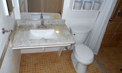 Barrier Free Bathroom Remodel, grab bars, fold up shower seat, tile roll in shower, accessible renovations, aging in place remodeling, roll under wheelchair accessible sink