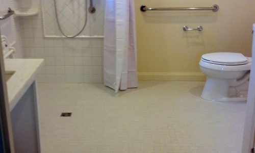 Wheelchair Accessible bathroom remodel with tile roll-in shower, custom roll under sink, fold up shower seat, accessible renovations, aging in place remodeling