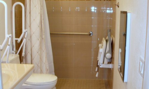 Barrier Free Bathroom remodel with fold up shower seat, fold up safety rail,raised toilet, roll-in shower, roll under sink, accessible renovations, aging in place remodeling