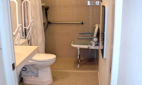 Barrier Free Bathroom remodel with fold up shower seat, fold up safety rail,raised toilet, roll-in shower, roll under sink, accessible renovations, aging in place remodeling
