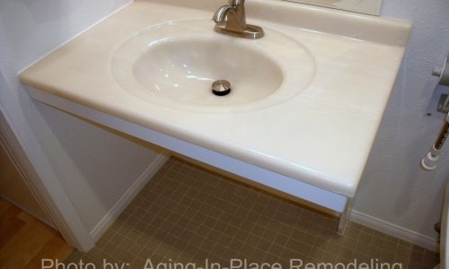 Barrier Free Bathroom remodel with fold up shower seat, fold up safety rail,raised toilet, roll-in shower, roll under sink, accessible renovations, aging in place remodeling