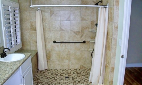Barrier Free Bathroom Remodel with grab bars and curved shower rod