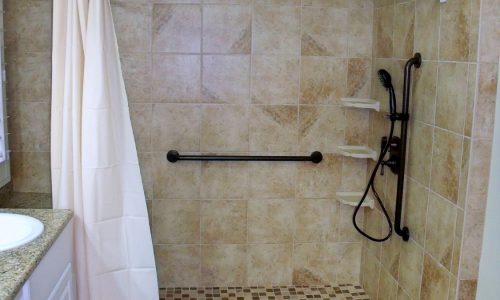 Barrier Free Bathroom Remodel with grab bars and curved shower rod