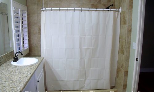 Barrier Free Bathroom Remodel with grab bars and curved shower rod