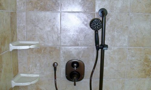 Barrier Free Bathroom Remodel with grab bars and curved shower rod