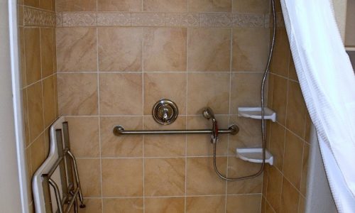 Barrier Free Shower with Fold Up Shower Bench, wheelchair accessible sink and shower, fold up safety rail