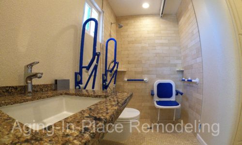 Accessible bathroom remodel, wall mount toilet, fold up shower seat, grab bars, wheelchair accessible sink and ceiling lift for safe transfer of client