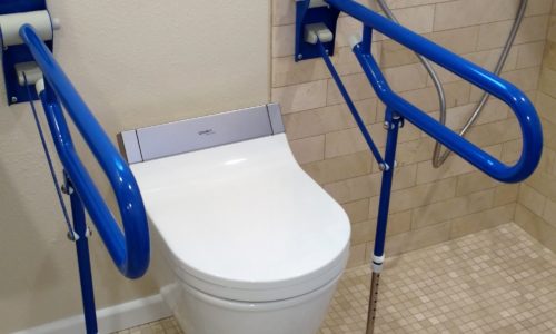 Accessible bathroom remodel, wall mount toilet, fold up shower seat, grab bars, wheelchair accessible sink and ceiling lift for safe transfer of client