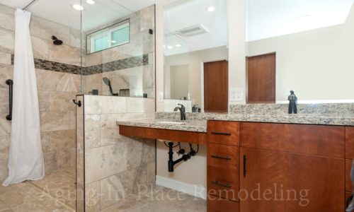 Barrier Free Shower, Wheelchair Accessible, Roll-In Shower, Roll Under Vanity, Fold Down Shower Seat, Raised Toilet, Automated Closet Bars that lower at the touch of a button,