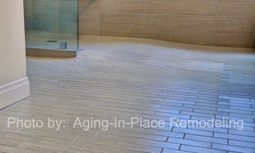 Accessible bathroom remodel with tile roll-in shower, roll under sink, fold up shower seat and grab bars