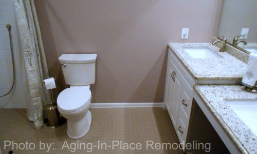 Wheelchair accessible bathroom remodel with barrier free roll in shower, grab bars, hand held shower head, roll under wheelchair accessible sink