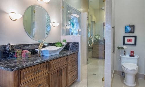 Bathroom remodel includes barrier free shower and custom tile. 