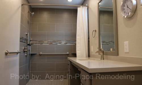 Custom tile barrier free shower remodel with roll-in shower, roll under sink, grab bars