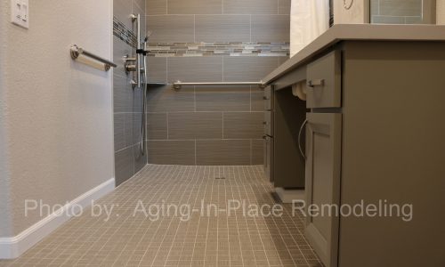 Custom tile barrier free shower remodel with roll-in shower, roll under sink, grab bars