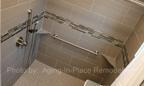 Custom tile barrier free shower remodel with roll-in shower, roll under sink, grab bars