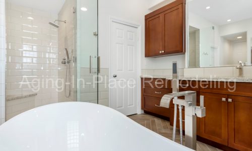 Bathroom remodel with low threshold shower, elegant flooring and gorgeous fixtures