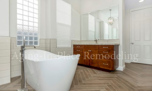 Bathroom remodel with low threshold shower, elegant flooring and gorgeous fixtures