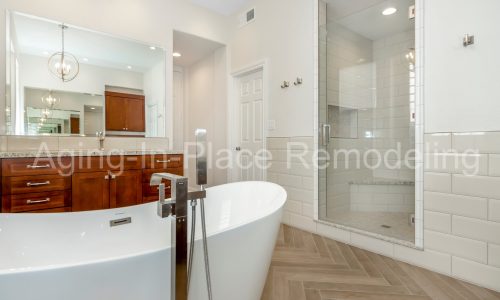 Bathroom remodel with low threshold shower, elegant flooring and gorgeous fixtures