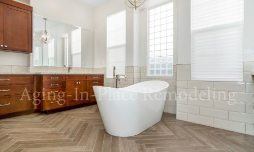 Bathroom remodel with low threshold shower, elegant flooring and gorgeous fixtures