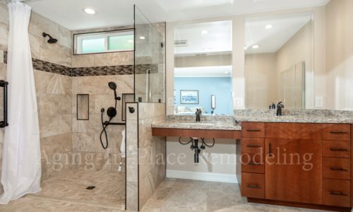 Roll-under sink, barrier free shower, raised toilet, grab bars, custom tile, fold-up shower seat, hand held shower head