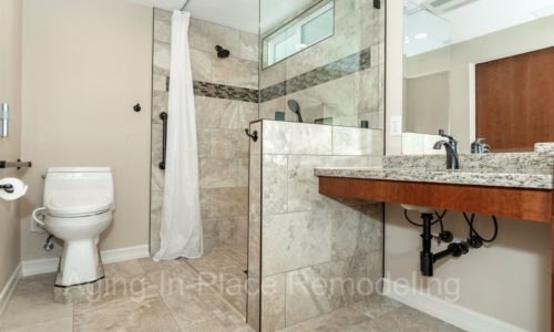 Roll-under sink, barrier free shower, raised toilet, grab bars, custom tile