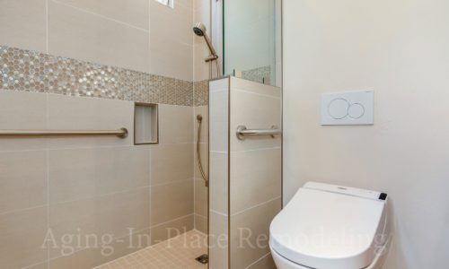 Master bathroom that includes wheelchair accessible shower, grab bars, bidet toilet