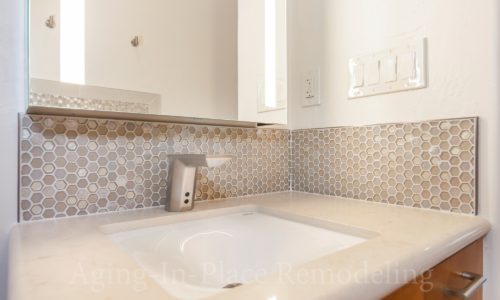 Custom tile back splash in this accessible bathroom remodel